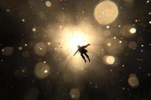 A man flying through the air in a space station photo