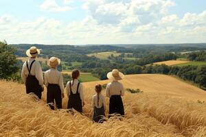A group of people in a field with a hat on photo