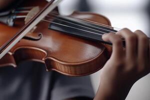 A close up of a person playing a violin photo