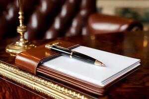 Notebook and pen on a desk in a hotel room photo