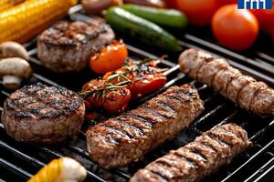 Grilled meat and vegetables on a grill photo
