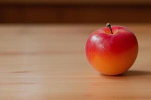 A red apple sitting on a table photo