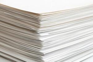 A stack of white paper on a table photo
