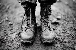 A pair of boots in the mud photo