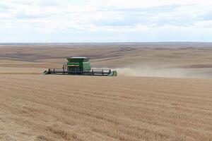 A large green machine in a field photo