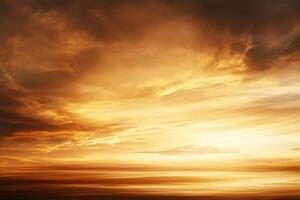 A sunset over the ocean with clouds photo