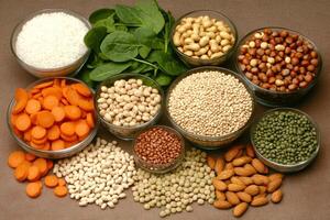 A variety of different types of beans, nuts, and vegetables photo