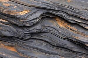 A close up of a rock wall with a lot of different colors photo