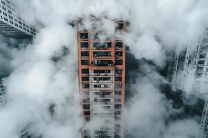 An aerial view of a tall building surrounded by clouds photo