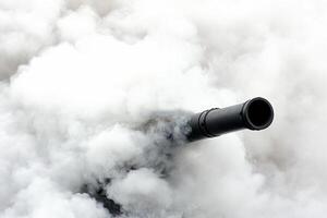 A black and white image of a cannon in the smoke photo