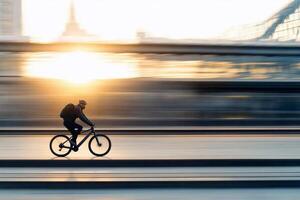 A man riding a bike in front of a city photo