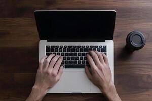 Hands typing on a laptop computer photo