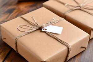 Two brown boxes wrapped in twine with a tag photo
