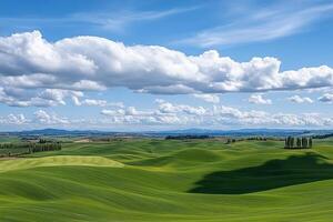 Rolling hills and green fields with clouds in the sky photo