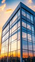 Modern Architecture A Glass Building Reflecting Urban Skyline at Sunset, Capturing the Essence of Contemporary Design and Corporate Innovation photo