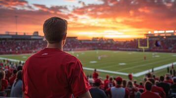 A Football Fan's Sunset View at the Stadium - Experience the Thrill of the Game Amidst the Crowd's Energy and the Sky's Fiery Canvas photo