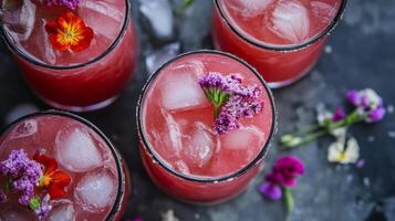 Exquisite Pink Cocktail A Refreshing Blend of Summer Flavors with Floral Garnishes and Chilled Ice Cubes for a Tasteful Celebration photo