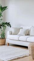 Serene Interior A Minimalist Living Room with White Sofa, Cushions, and a Touch of Greenery for a Fresh and Elegant Lifestyle. photo