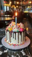 Festive Cake with a Candle and Sprinkles for a Sweet Birthday Bash photo