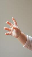 Baby's Delicate Hand Reaching photo