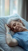 Senior Patient Resting in a Hospital Bed photo