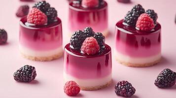 Delicate Berry Cheesecakes on a Pink Background photo