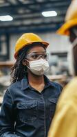 Focused Female Industrial Worker in Protective Gear photo