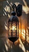 Ornamental Black Lantern on Stone Wall photo