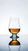 Golden Whisky in a Delicate Snifter Glass photo