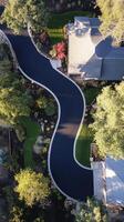 Stunning Aerial View of a Modern Home's Curvy Driveway and Landscaping photo