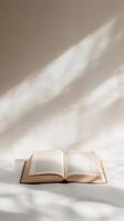 Open Book Under Soft Sunlight A Timeless Still Life photo