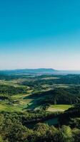 Serene Countryside Panorama Lush Fields and Majestic Mountains photo