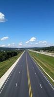 Highway stretching into the horizon, a scenic view of the open road. photo