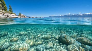 Crystal Clear Waters A Tranquil Landscape of Lake Tahoe with Underwater Rocks, Mountains, and Blue Sky - A Scenic Seascape for Nature Lovers photo