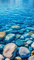 Crystal Clear Waters A Serene Underwater Landscape with Smooth Stones and Rippling Sunlight, Perfect for a Calming Nature Background or Scenic Wallpaper photo