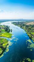 Breathtaking Nile River Panorama A Serene Aerial View of Egypt's Lifeline, Capturing the Lush Greenery and Azure Waters Under a Clear Blue Sky photo