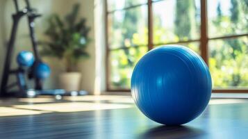 Blue Exercise Ball Ready for a Home Workout, Promoting Health, Strength, and Wellbeing in a Bright, Modern Setting for a Balanced Lifestyle. photo