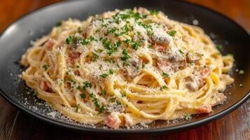 Exquisite Spaghetti Carbonara A Culinary Masterpiece with Bacon, Cream, and Parmesan Cheese, Garnished with Parsley, Served on a Black Plate photo