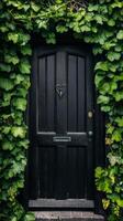 Enchanting Black Doorway Cloaked in Verdant Ivy photo