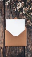 Elegant Kraft Envelope with Blank Card on Rustic Wood, Adorned with Dried Flowers - Perfect for Invitations, Greetings, and Personalized Messages photo