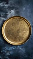 Golden Plate on Dark Textured Background photo