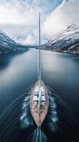 Majestic Yacht Sailing Through a Norwegian Fjord photo