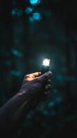 A flashlight clutched in a hand photo