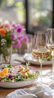 Elegant Wine and Salad Still Life A Symphony of Flavors. A vibrant salad paired with crisp wine, capturing a moment of culinary delight and healthy indulgence. photo