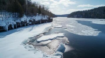 Serene Winter View A Frozen River and Snow-Blanketed Shoreline photo