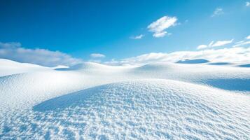 Stunning Winter Landscape with Snow-Covered Hills Under a Clear Blue Sky photo