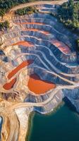 Aerial View of a Quarry with Terraced Pools of Red Water photo