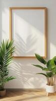 Empty Wooden Frame on a Light Wall with Plants photo