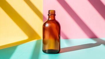 Stylish Brown Glass Bottle on Vibrant Pastel Background photo