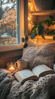 Cozy Autumn Evening by the Window with Book and Warm Drinks photo